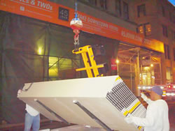 Hoisting Sheetrock through window